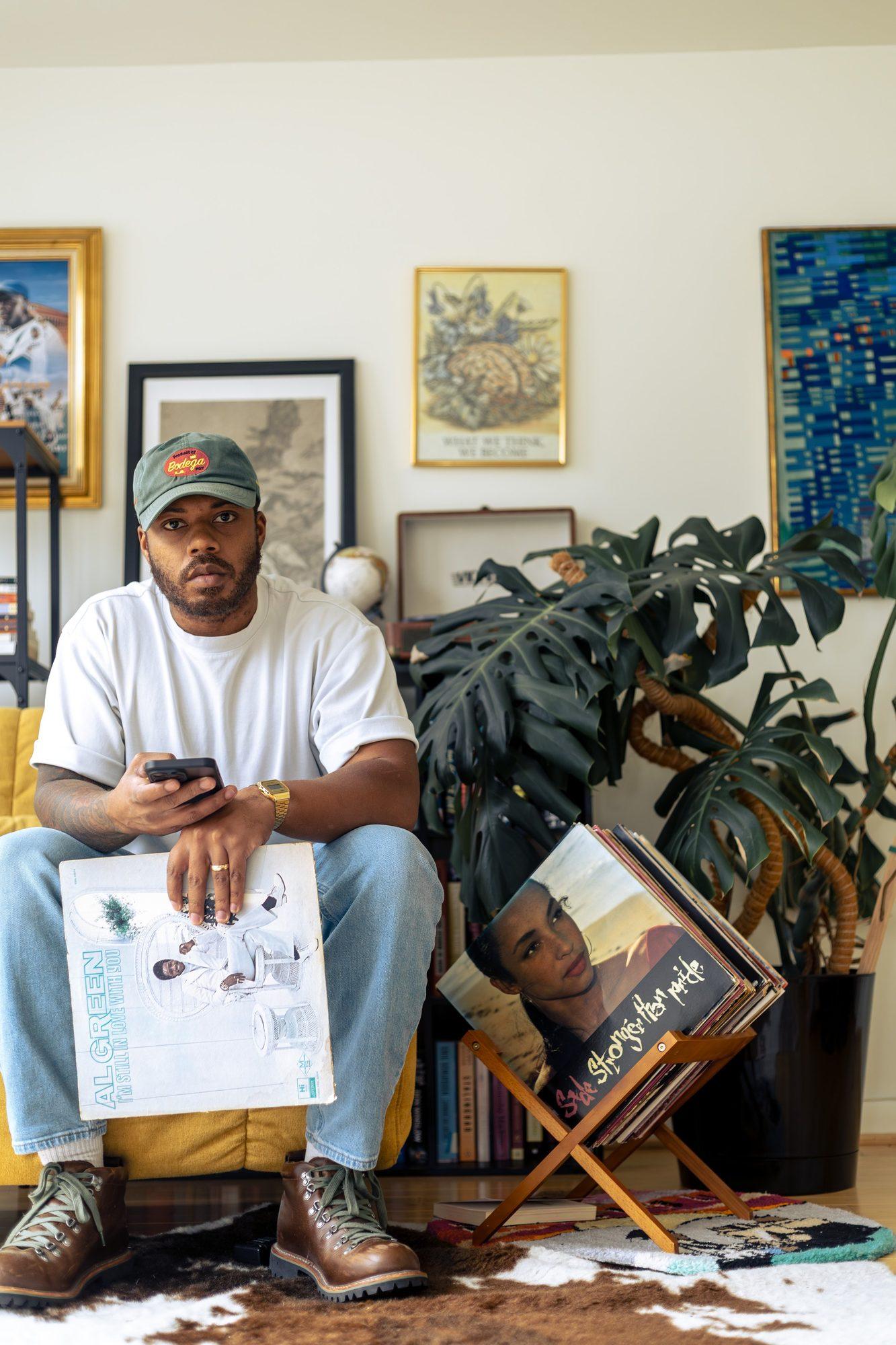 Deverrick Holmes seated in his studio
